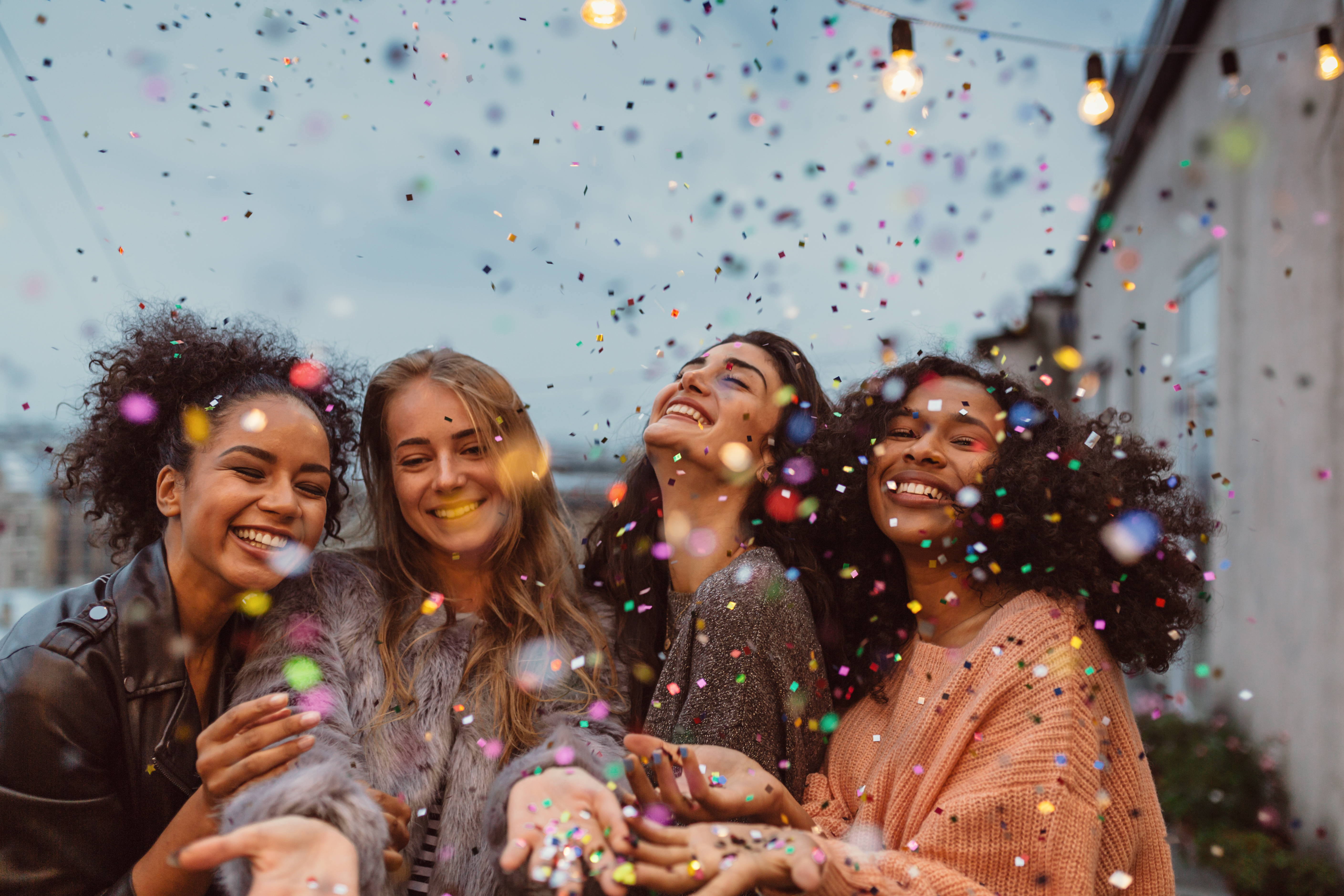 a group of people are smiling as they have broken through from anxiety, pain, hurt and overcome challenges.