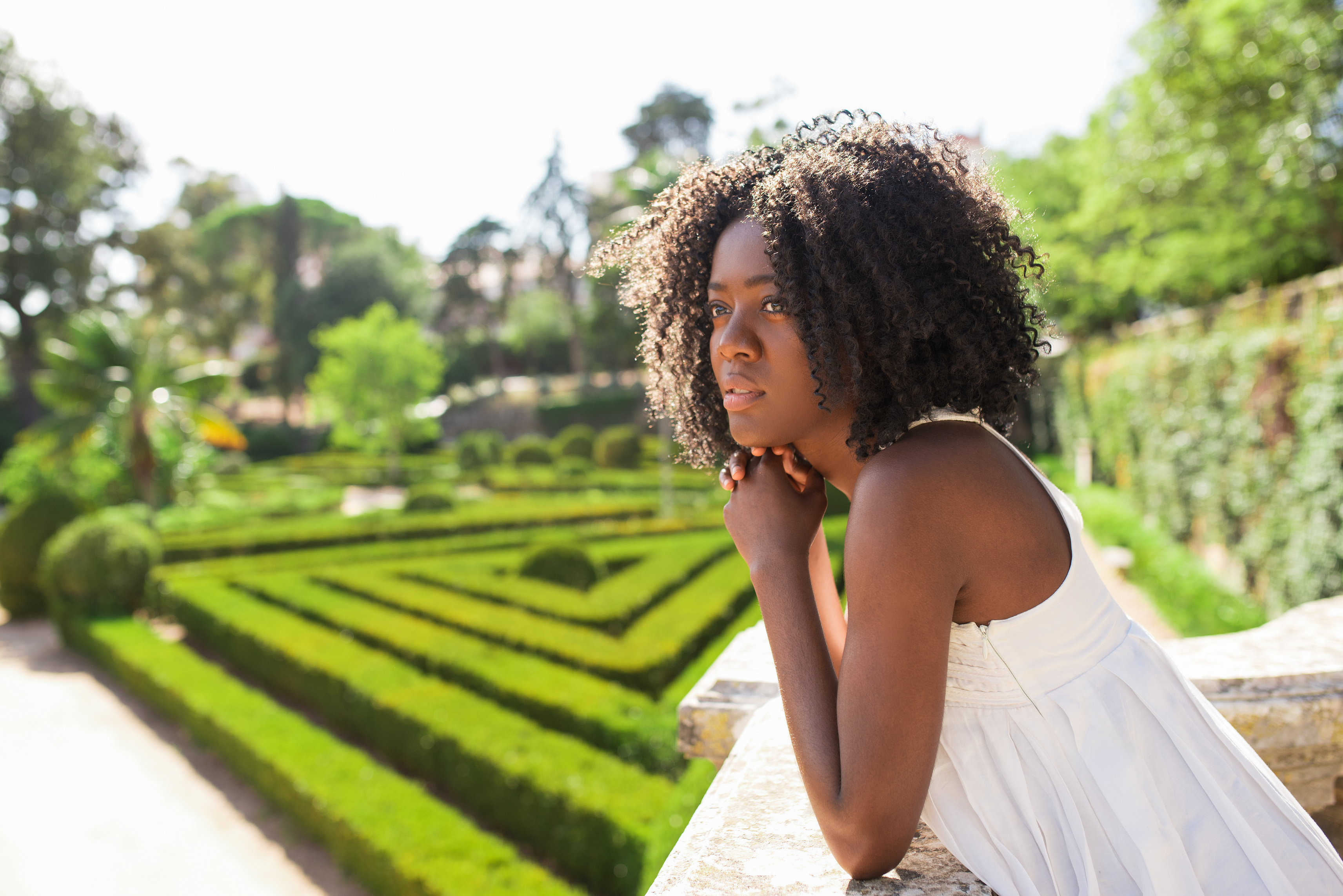 Pensive Young Black Woman Relaxing in Park